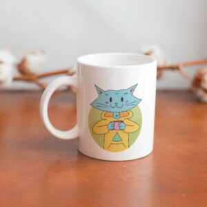 Cat Bud Mug is a plain white mug with an illustration of a cute blue cat sipping on a hot beverage